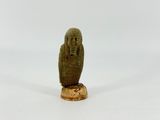 an image of a statue of an owl sitting on top of a wooden base