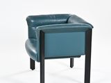 the back of a blue leather chair against a white background