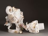 two figurines that are sitting next to each other