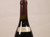 a bottle of wine that is sitting on a table