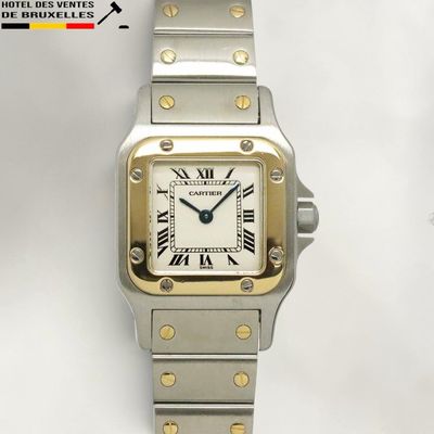 an image of a silver and gold wrist watch with roman numerals