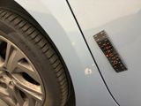 a sticker on the side of a car that has a sticker on it