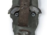 an image of a mask made out of a rock