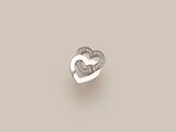 an open heart shaped diamond ring on a beige background