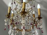a chandelier that has a lot of crystals hanging from it