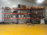 a large room with a lot of shelves and boxes on it