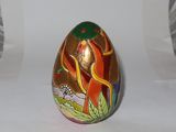 a decorative egg with a picture of a woman on it