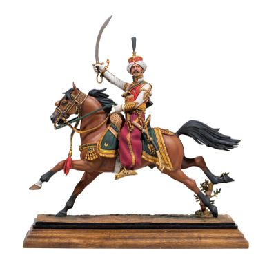 statue of a man riding on a horse with a sword in his hand