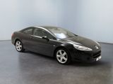 a picture of a black car parked in a room