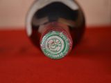 a close up of a bottle of wine on a table