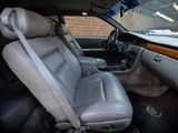 a picture of a car with a leather seat and a steering wheel