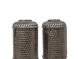 a pair of metal salt and pepper shakers on a white background