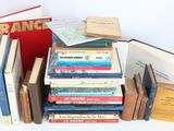 several books are stacked on top of each other on a table