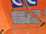a close up of a sign on an orange piece of equipment