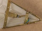 a picture of a triangle shaped light fixture with a cord connected to it