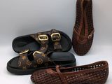louis vuitton shoes, sunglasses, and a pair of slippers
