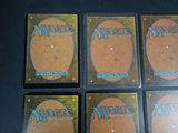 four decks of magic the gathering are shown on a table