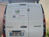 a white van that is parked on the side of the road