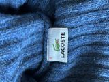 blue sweater with lacoste logo on it