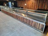 a glass display case in the middle of the room