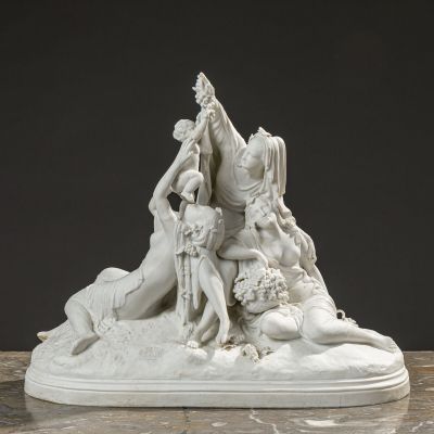 sculpture of a group of people sitting on top of a white base