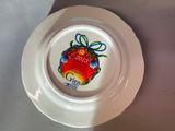 a white plate with a picture of a christmas ornament on it