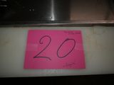 a pink sign that says 20 on the side of a stove