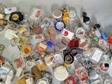 a pile of key chains with various items on them