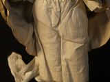 an image of a statue of a woman in a white robe