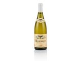a bottle of white wine sitting on top of a white table