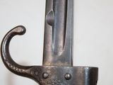 a close up of a sword with a metal handle