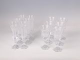 two clear glass vases sitting on top of a white table