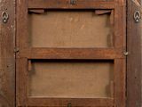 a picture of an old wooden picture frame on a wall