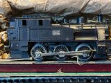 a toy train sitting in a box on a table