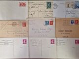 many letters and envelopes that are on the table