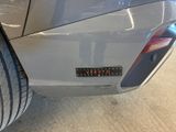 a close up of a car ' s rear bumper with a sticker on it
