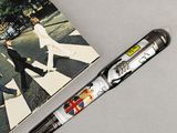 a pen that is laying on a table next to a book