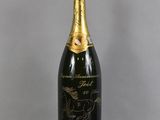 a close up of a bottle of champagne on a table