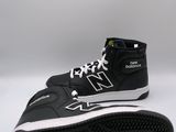 black and white new balance shoes on a white background