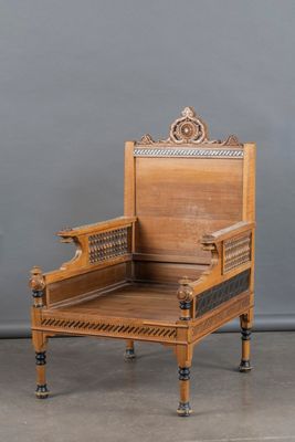 an image of a wooden chair sitting on top of a cement floor