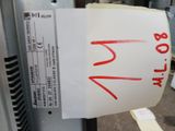 a sticker on the side of a machine that has a price tag attached to it