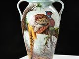 a vase with a painting of a pheasant and a pheasant on it