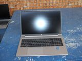 two laptops that are sitting on a blue table