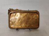 gold plated metal belt buckle with a bird on it