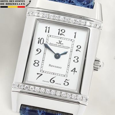 an image of a close up of a wrist watch with diamonds on it