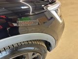 a close up of a car with a sticker on the front of it