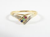 a gold ring with a multi colored stone and diamond accents