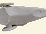 a small toy whale that is sitting on a table