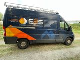 an image of a van parked on the side of the road