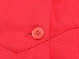 a close up of a red jacket with buttons on it